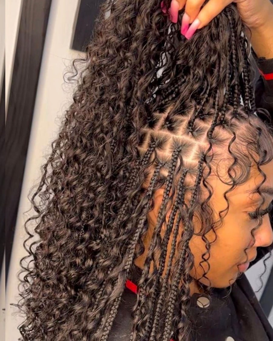 Long boho knotless braids with curly ends and neat square parting