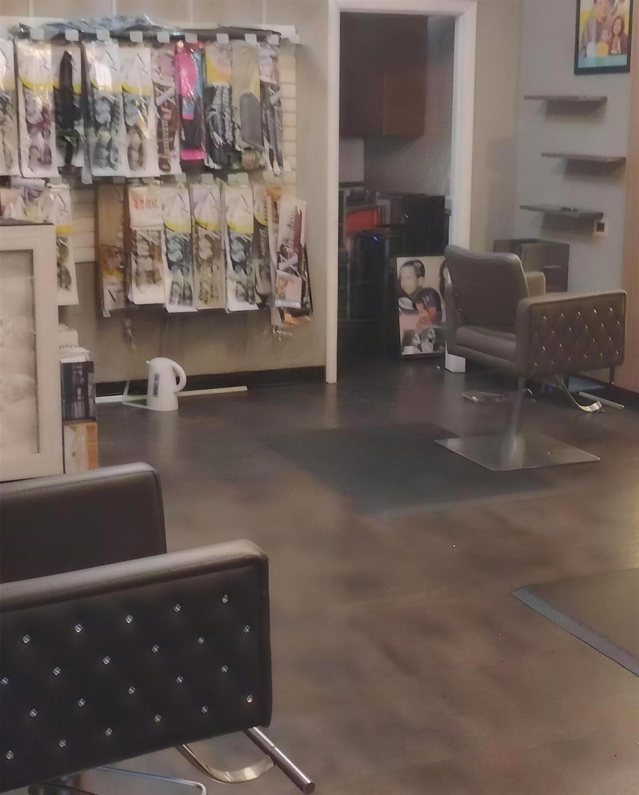 The studio's braiding hair wall and styling chairs